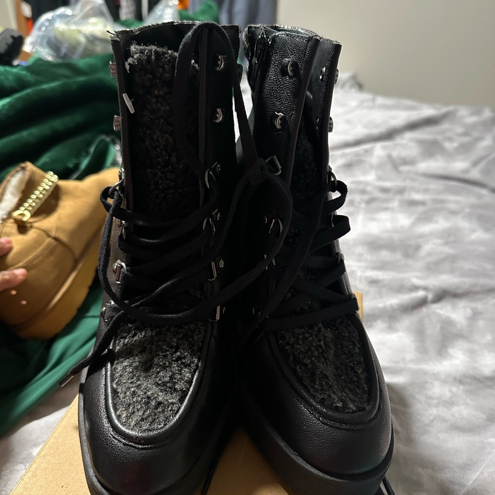 Jessica Simpson 
Black  Women's Boots, Wedges hill will fur in them.